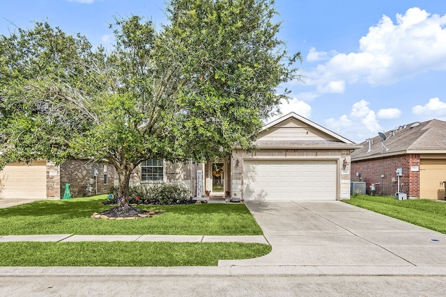 15110 Sierra Ridge Dr, Humble, TX 77396 - view of front of home with brick siding, driveway, a front lawn, and an attached garage
