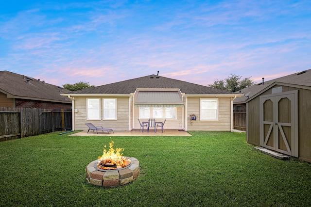 15110 Sierra Ridge Dr, Humble, TX 77396 - back of house with an outdoor fire pit, a patio, a shed, and a fenced backyard
