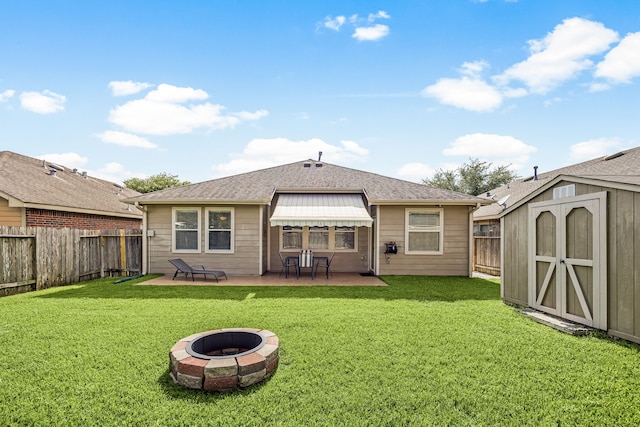 15110 Sierra Ridge Dr, Humble, TX 77396 - back of property featuring a patio area, a fenced backyard, a storage unit, and an outdoor fire pit