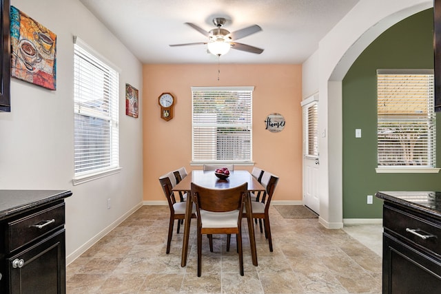 15110 Sierra Ridge Dr, Humble, TX 77396 - dining space with ceiling fan and arched walkways