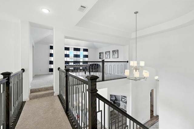 2607 Open Prairie Ln, Katy, TX 77493 - hallway featuring an upstairs landing, a raised ceiling, carpet floors, recessed lighting, and arched walkways