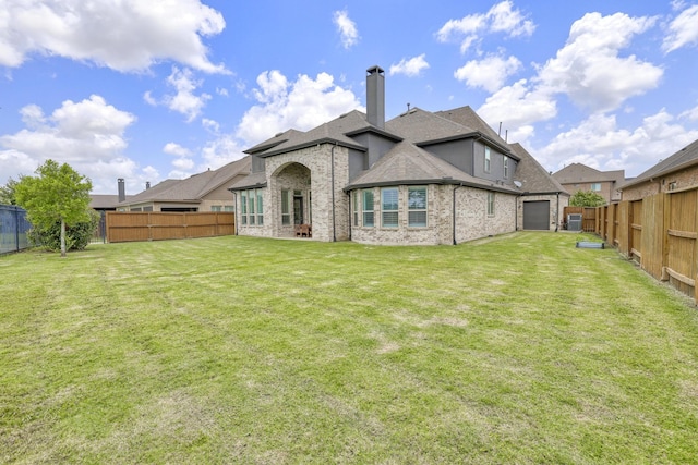 2607 Open Prairie Ln, Katy, TX 77493 - rear view of property featuring a fenced backyard, a shingled roof, a chimney, and brick siding
