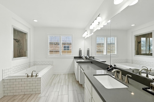 2607 Open Prairie Ln, Katy, TX 77493 - full bathroom featuring double vanity, a garden tub, and recessed lighting