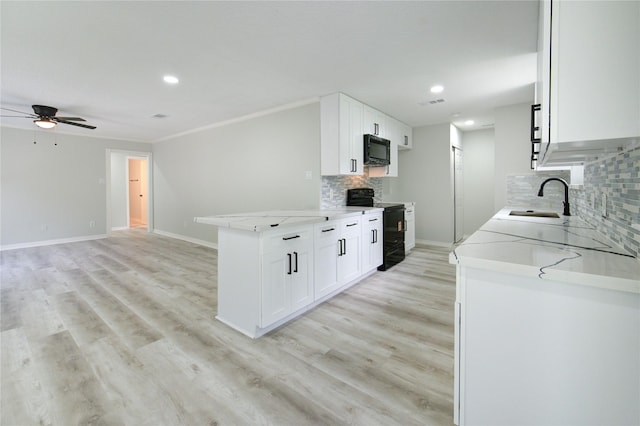 1221 Delores St, Kemah, TX 77565 - kitchen featuring black appliances, ceiling fan, tasteful backsplash, recessed lighting, and white cabinetry