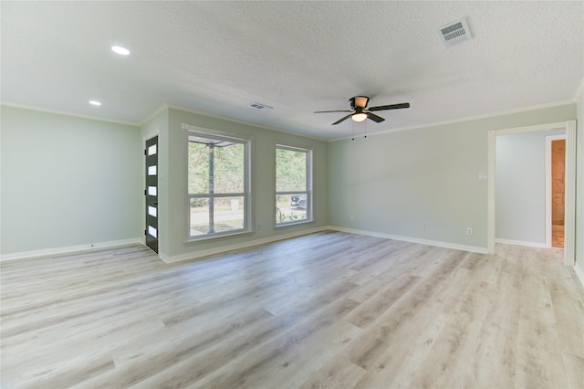 1221 Delores St, Kemah, TX 77565 - unfurnished living room featuring crown molding, light wood-type flooring, ceiling fan, a textured ceiling, and recessed lighting
