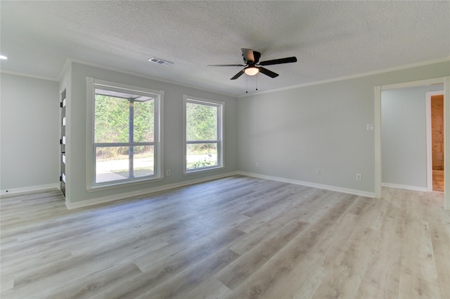 1221 Delores St, Kemah, TX 77565 - unfurnished room featuring ornamental molding, a ceiling fan, light wood finished floors, and a textured ceiling