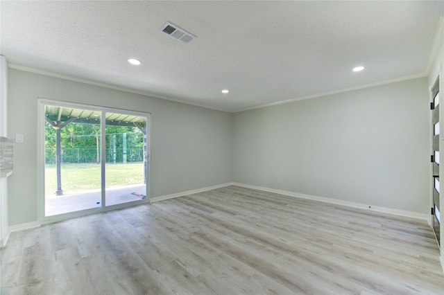 1221 Delores St, Kemah, TX 77565 - spare room with recessed lighting, ornamental molding, light wood-type flooring, and a textured ceiling