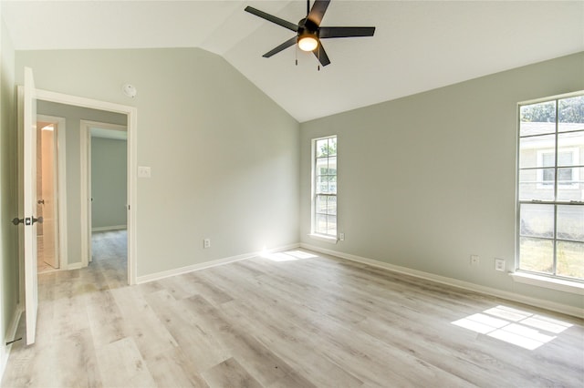 1221 Delores St, Kemah, TX 77565 - empty room with ceiling fan, healthy amount of natural light, lofted ceiling, and light wood-style flooring