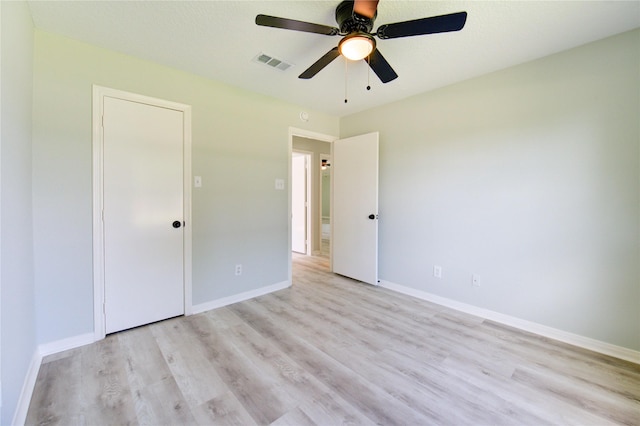 1221 Delores St, Kemah, TX 77565 - unfurnished bedroom with light wood-style flooring and a ceiling fan