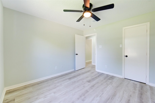 1221 Delores St, Kemah, TX 77565 - unfurnished bedroom with light wood-type flooring and ceiling fan
