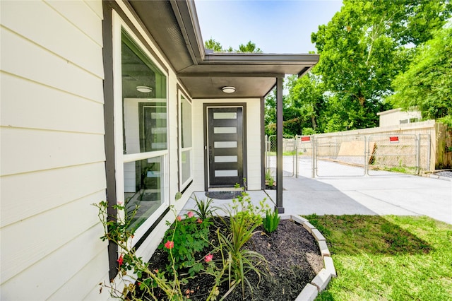1221 Delores St, Kemah, TX 77565 - view of exterior entry featuring a gate