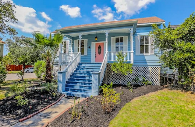 3128 Avenue N, Galveston, TX 77550 - view of front of property featuring covered porch and stairs