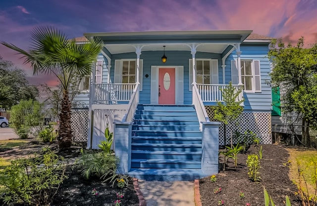 3128 Avenue N, Galveston, TX 77550 - view of front of home featuring covered porch and stairs