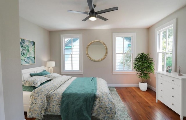 3128 Avenue N, Galveston, TX 77550 - bedroom featuring wood finished floors, multiple windows, and ceiling fan