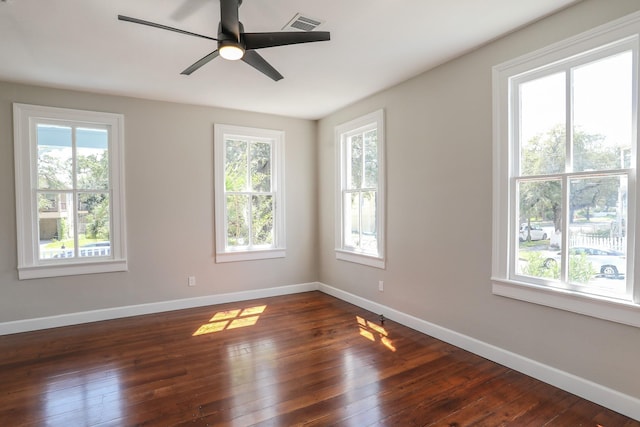 3128 Avenue N, Galveston, TX 77550 - empty room with plenty of natural light, dark wood-style flooring, and ceiling fan