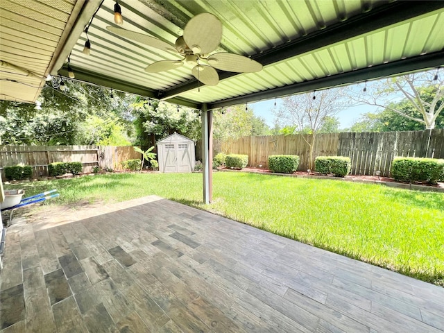 8009 Dellanera Dr, Hitchcock, TX 77563 - fenced backyard with a storage shed, ceiling fan, and a patio