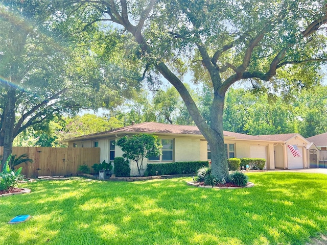 8009 Dellanera Dr, Hitchcock, TX 77563 - ranch-style home featuring an attached garage, driveway, and a gate