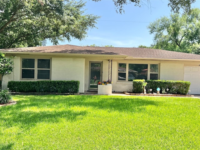 8009 Dellanera Dr, Hitchcock, TX 77563 - ranch-style house with a garage, a front lawn, and roof with shingles