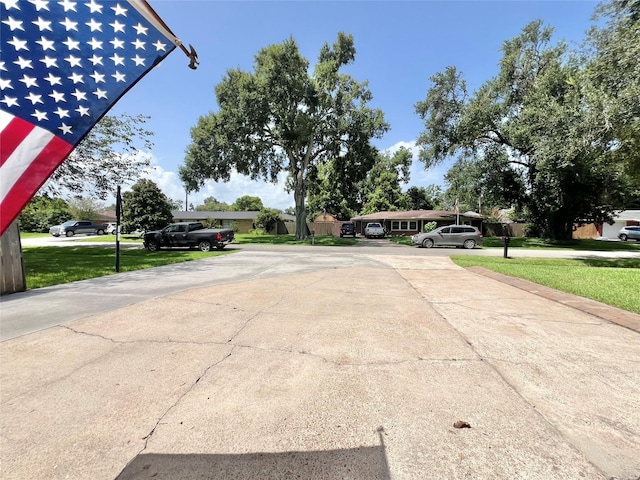 8009 Dellanera Dr, Hitchcock, TX 77563 - view of concrete driveway