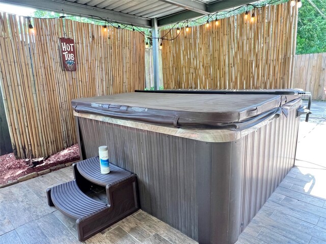 8009 Dellanera Dr, Hitchcock, TX 77563 - view of patio / terrace featuring a hot tub