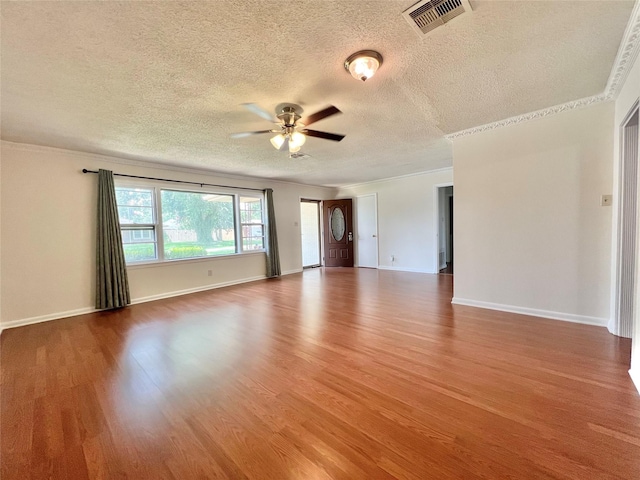 8009 Dellanera Dr, Hitchcock, TX 77563 - spare room with ceiling fan, a textured ceiling, crown molding, and wood finished floors