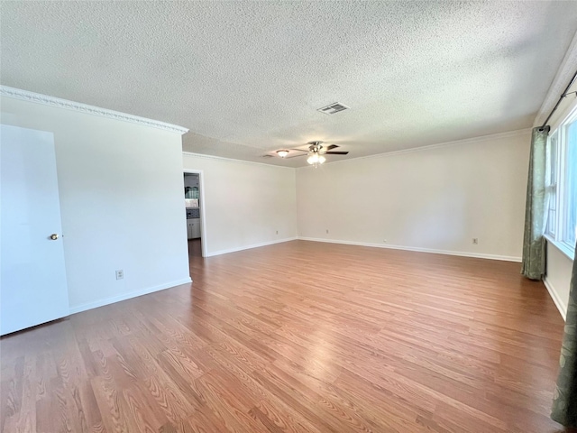 8009 Dellanera Dr, Hitchcock, TX 77563 - unfurnished room with wood finished floors, crown molding, ceiling fan, and a textured ceiling