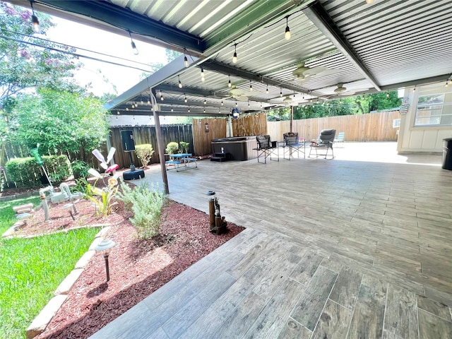 8009 Dellanera Dr, Hitchcock, TX 77563 - fenced backyard with a hot tub, a patio area, and a deck