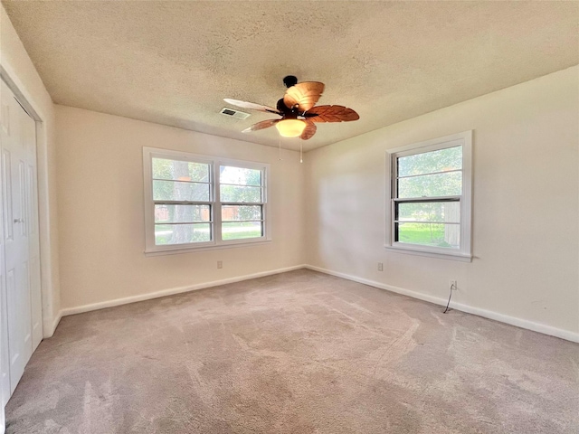 8009 Dellanera Dr, Hitchcock, TX 77563 - unfurnished room featuring carpet floors, a textured ceiling, and ceiling fan