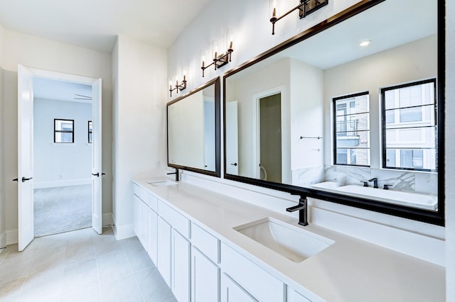 12008 Royal Oaks Banner Way, Houston, TX 77082 - bathroom with double vanity, a bath, and tile patterned flooring