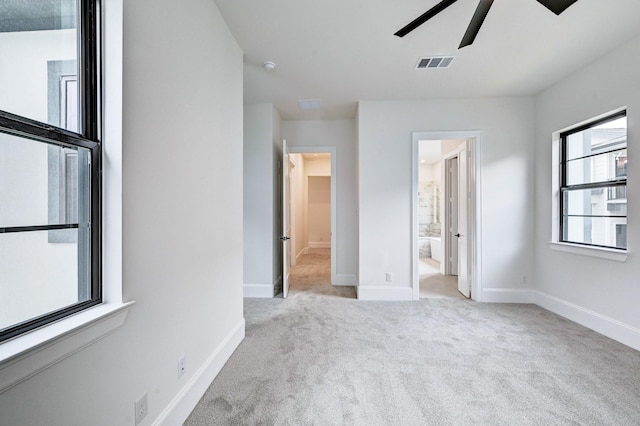 12008 Royal Oaks Banner Way, Houston, TX 77082 - unfurnished bedroom featuring light carpet, ensuite bath, and ceiling fan
