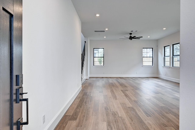 12008 Royal Oaks Banner Way, Houston, TX 77082 - empty room featuring plenty of natural light, ceiling fan, wood finished floors, and recessed lighting