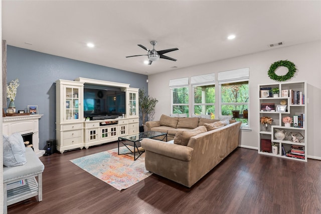 1942 Elkington Cir, Conroe, TX 77304 - living room with ceiling fan, dark wood finished floors, a fireplace with raised hearth, and recessed lighting