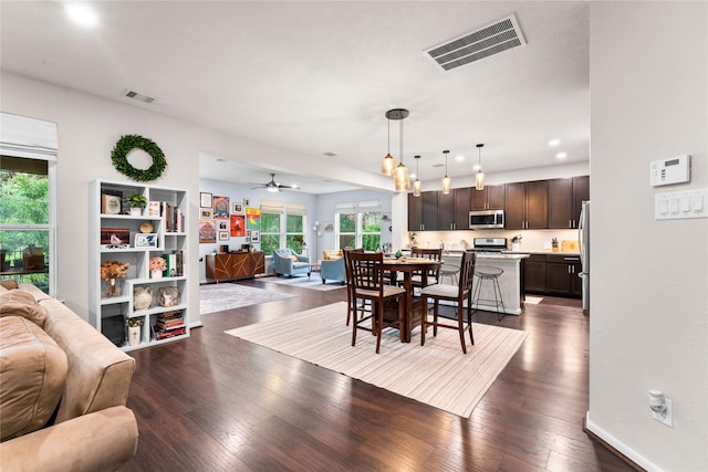 1942 Elkington Cir, Conroe, TX 77304 - dining room with dark wood finished floors, ceiling fan, and recessed lighting