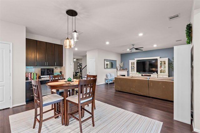 1942 Elkington Cir, Conroe, TX 77304 - dining area featuring dark wood finished floors, recessed lighting, stairway, and ceiling fan