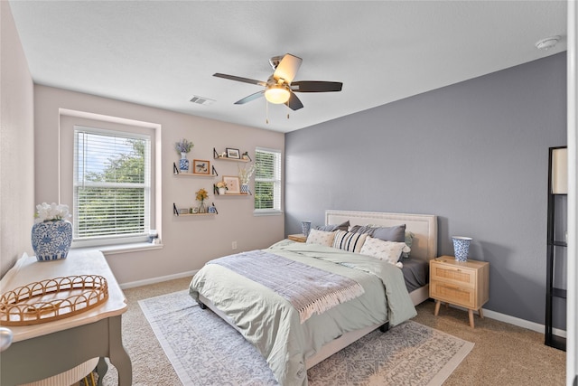 1942 Elkington Cir, Conroe, TX 77304 - carpeted bedroom with multiple windows and a ceiling fan