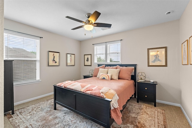 1942 Elkington Cir, Conroe, TX 77304 - carpeted bedroom with baseboards and a ceiling fan