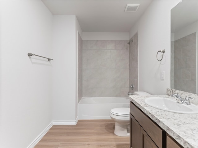 304 N Orange St, Sweeny, TX 77480 - full bathroom with wood finished floors, vanity, and shower / bathtub combination