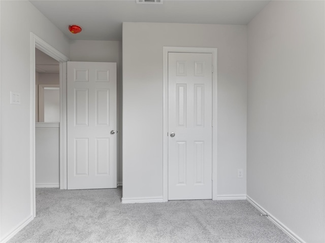 304 N Orange St, Sweeny, TX 77480 - unfurnished bedroom featuring carpet and baseboards