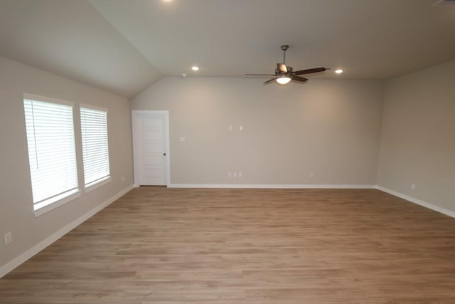 4989 Perennial Ln, La Marque, TX 77568 - empty room featuring a ceiling fan, recessed lighting, light wood-style floors, and vaulted ceiling