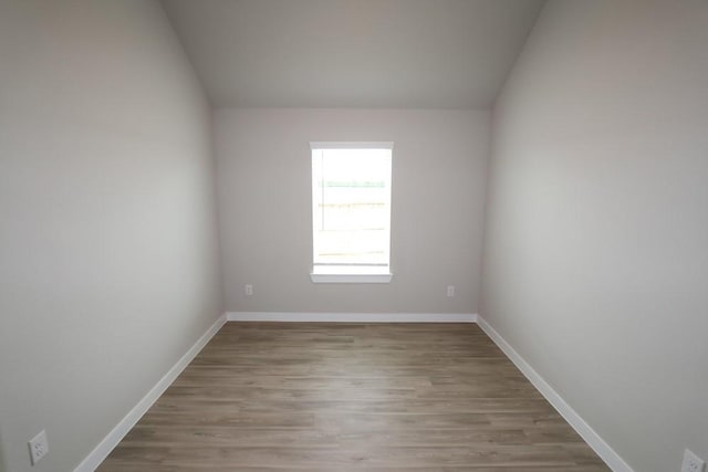 4989 Perennial Ln, La Marque, TX 77568 - empty room with wood finished floors and lofted ceiling