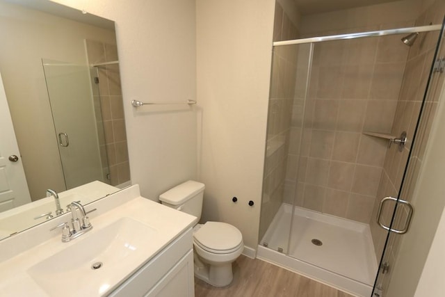 4989 Perennial Ln, La Marque, TX 77568 - bathroom featuring vanity, a stall shower, and wood finished floors