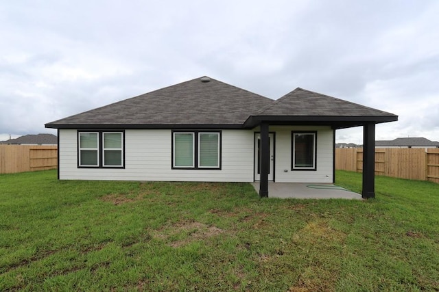 4989 Perennial Ln, La Marque, TX 77568 - back of house with a shingled roof, a patio area, and a fenced backyard