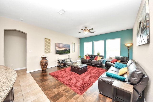 9430 Jayci Hills Ln, Cypress, TX 77433 - living area with a ceiling fan, arched walkways, and wood finished floors