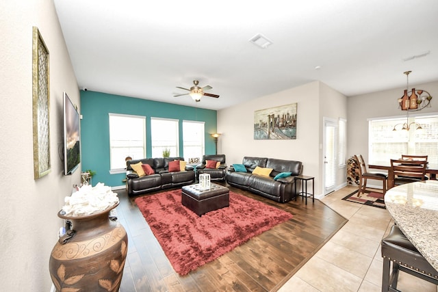 9430 Jayci Hills Ln, Cypress, TX 77433 - living room with ceiling fan, wood finished floors, and a chandelier