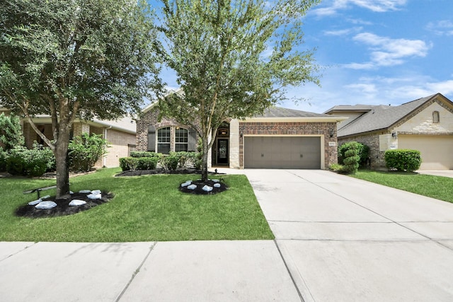 9430 Jayci Hills Ln, Cypress, TX 77433 - view of front of home with brick siding, an attached garage, driveway, and a front yard