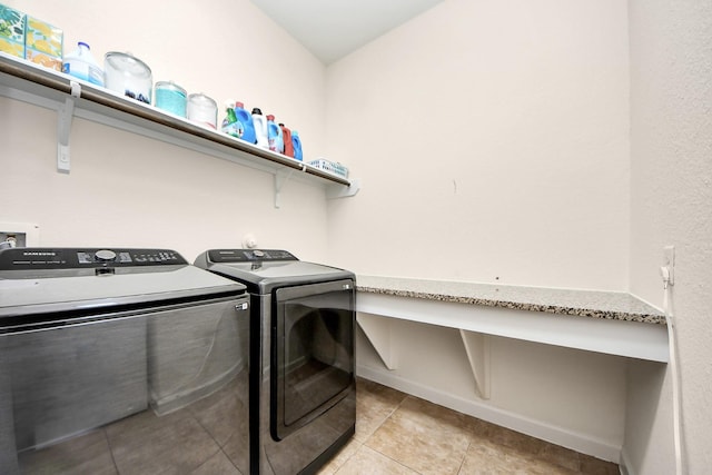 9430 Jayci Hills Ln, Cypress, TX 77433 - washroom featuring washer and clothes dryer, light tile patterned flooring, and a desk