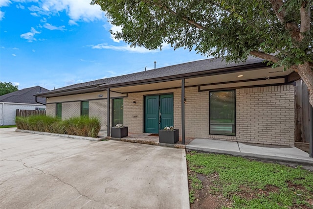 6206 San Felipe St, Houston, TX 77057 - view of front of house featuring brick siding and a patio
