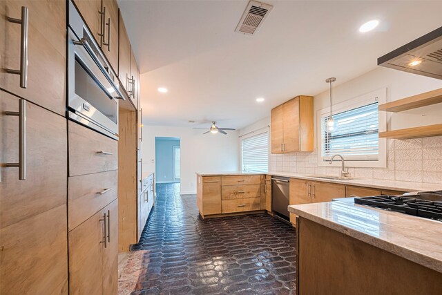 6206 San Felipe St, Houston, TX 77057 - kitchen featuring light brown cabinetry, dishwasher, a peninsula, decorative backsplash, and recessed lighting