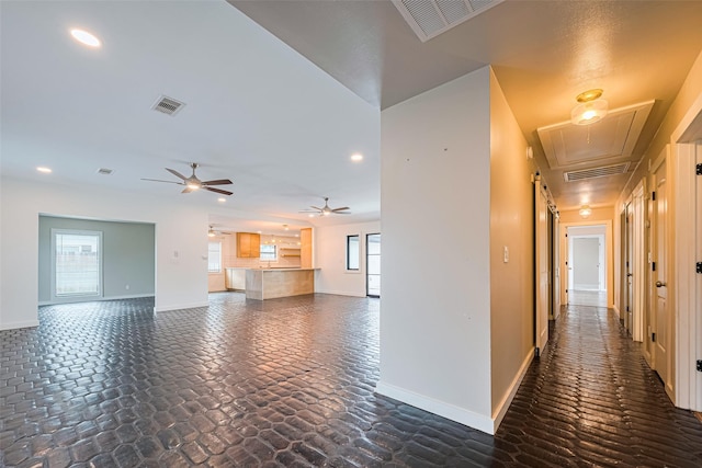 6206 San Felipe St, Houston, TX 77057 - corridor with attic access, recessed lighting, and dark stone finish flooring