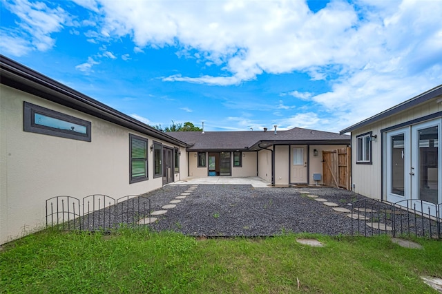 6206 San Felipe St, Houston, TX 77057 - back of house with a patio, stucco siding, and a lawn